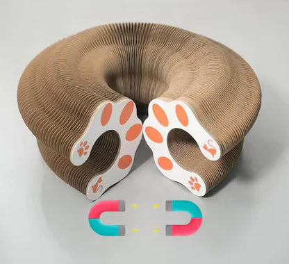 Cardboard pet toy shaped like a U with paw prints on a white background