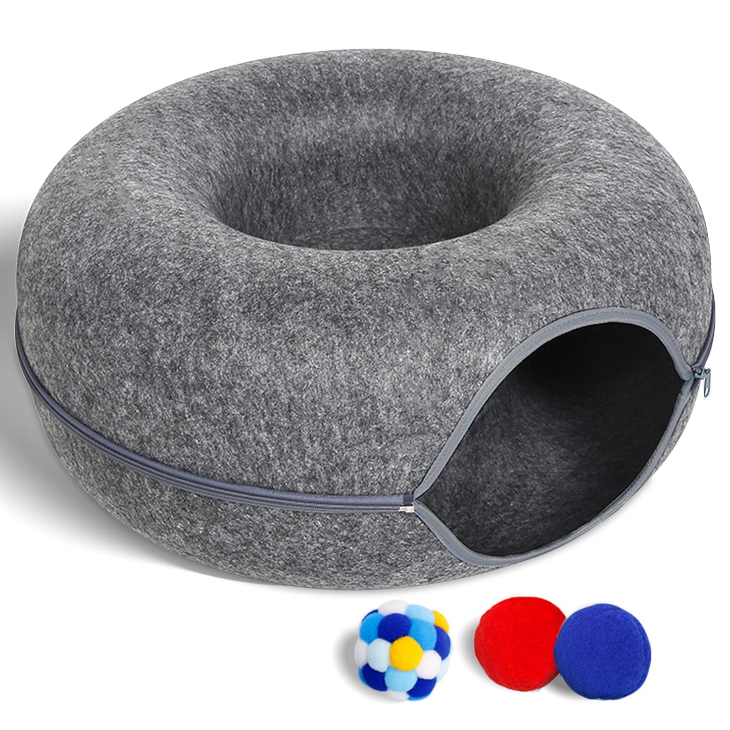 Gray donut-shaped pet bed with a small door and three colorful balls on a white background