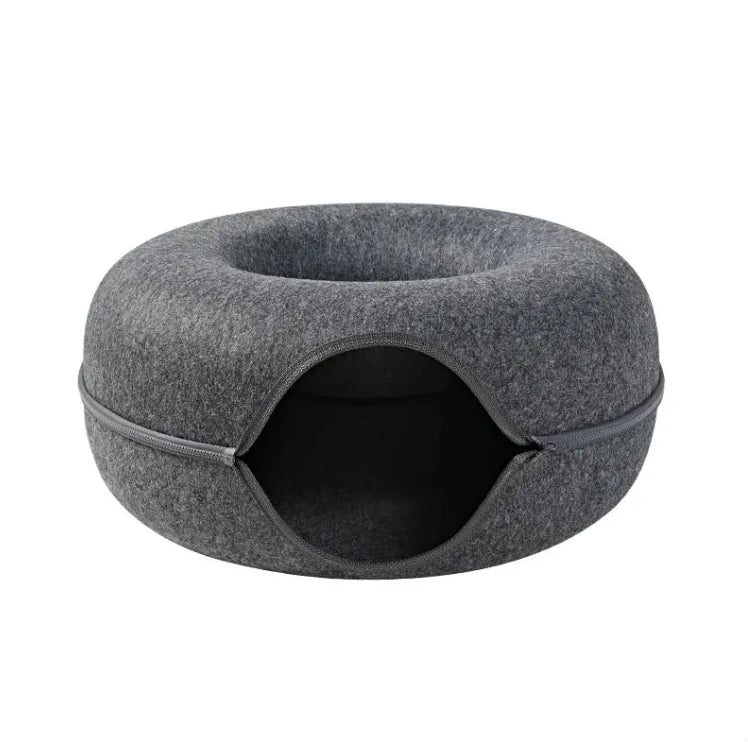 Gray pet bed with a round entrance on a white background