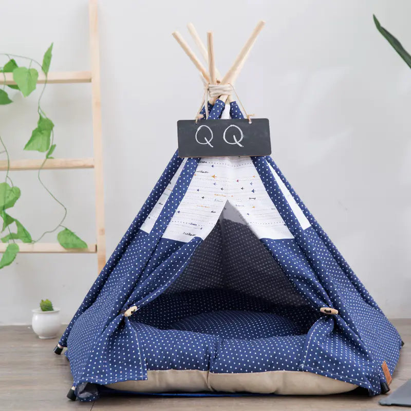 Pet teepee with star pattern and a sleeping dog inside