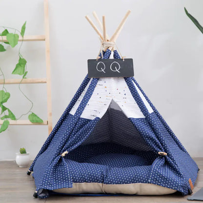 Pet teepee with star pattern and a sleeping dog inside