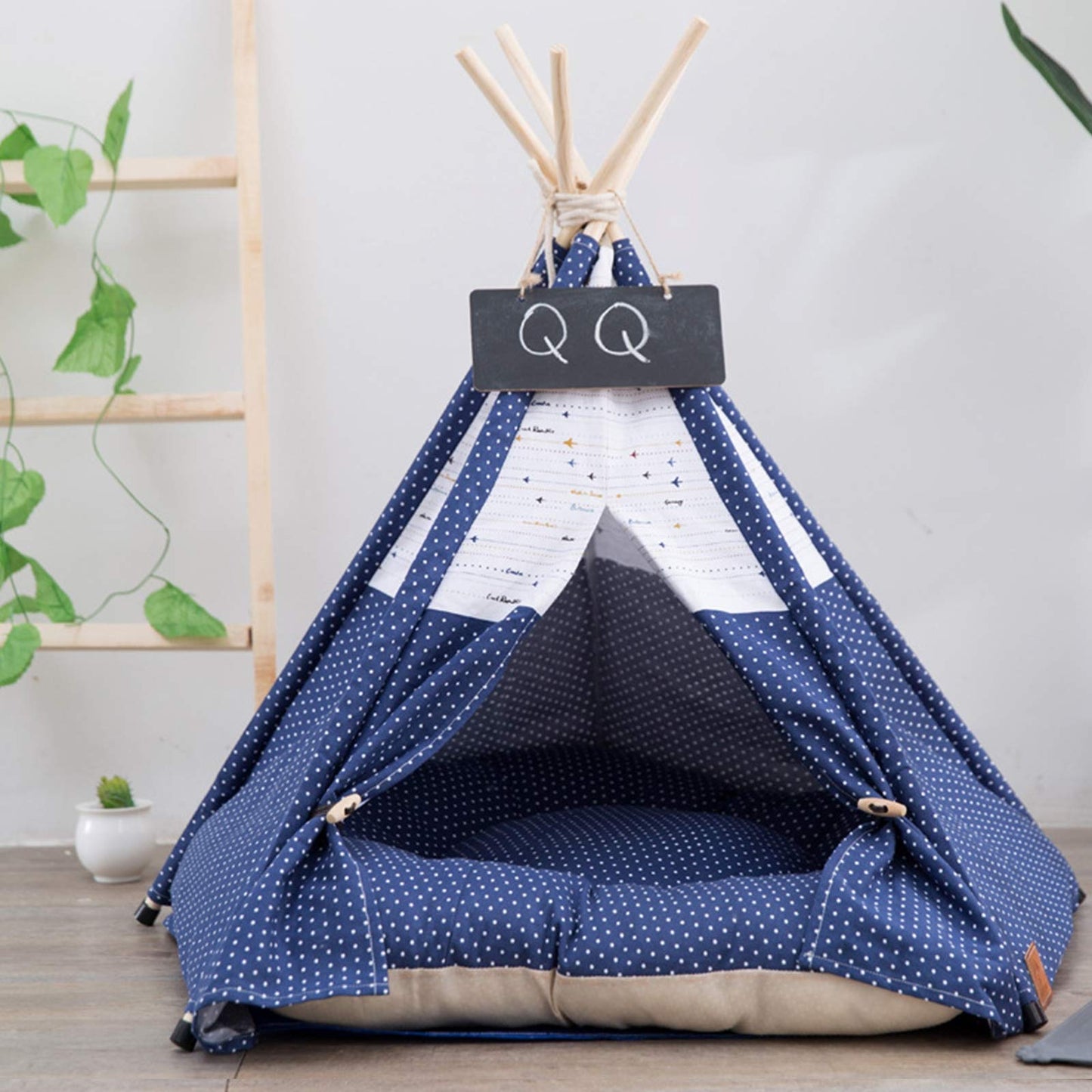 Pet teepee with star pattern and a sleeping dog inside