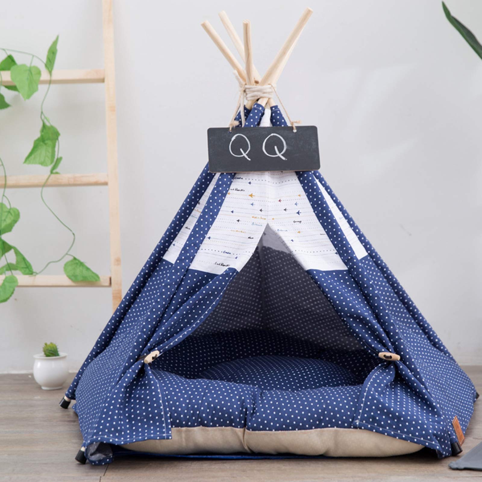 Pet teepee with star pattern and a sleeping dog inside