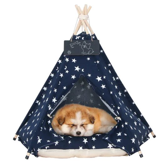 Pet teepee with star pattern and a sleeping dog inside on a white background