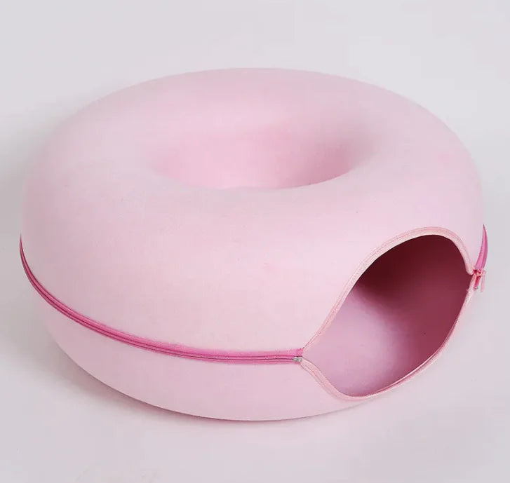 Pink pet bed with a zipper on a light gray background